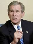 [ One of George W Bush's signature facial expressions: A sneer ]