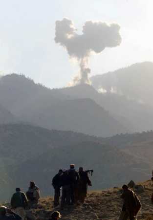 [ Tora Bora, Afghanistan, 15Dec01. U.S. bomb exploding in the distance.... ]