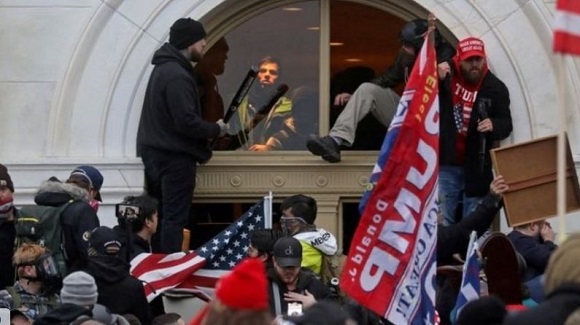 United States Capitol being mobbed by Trump supporters, 2021CE.